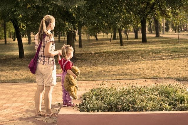 Family strolling in the park on a sunny day