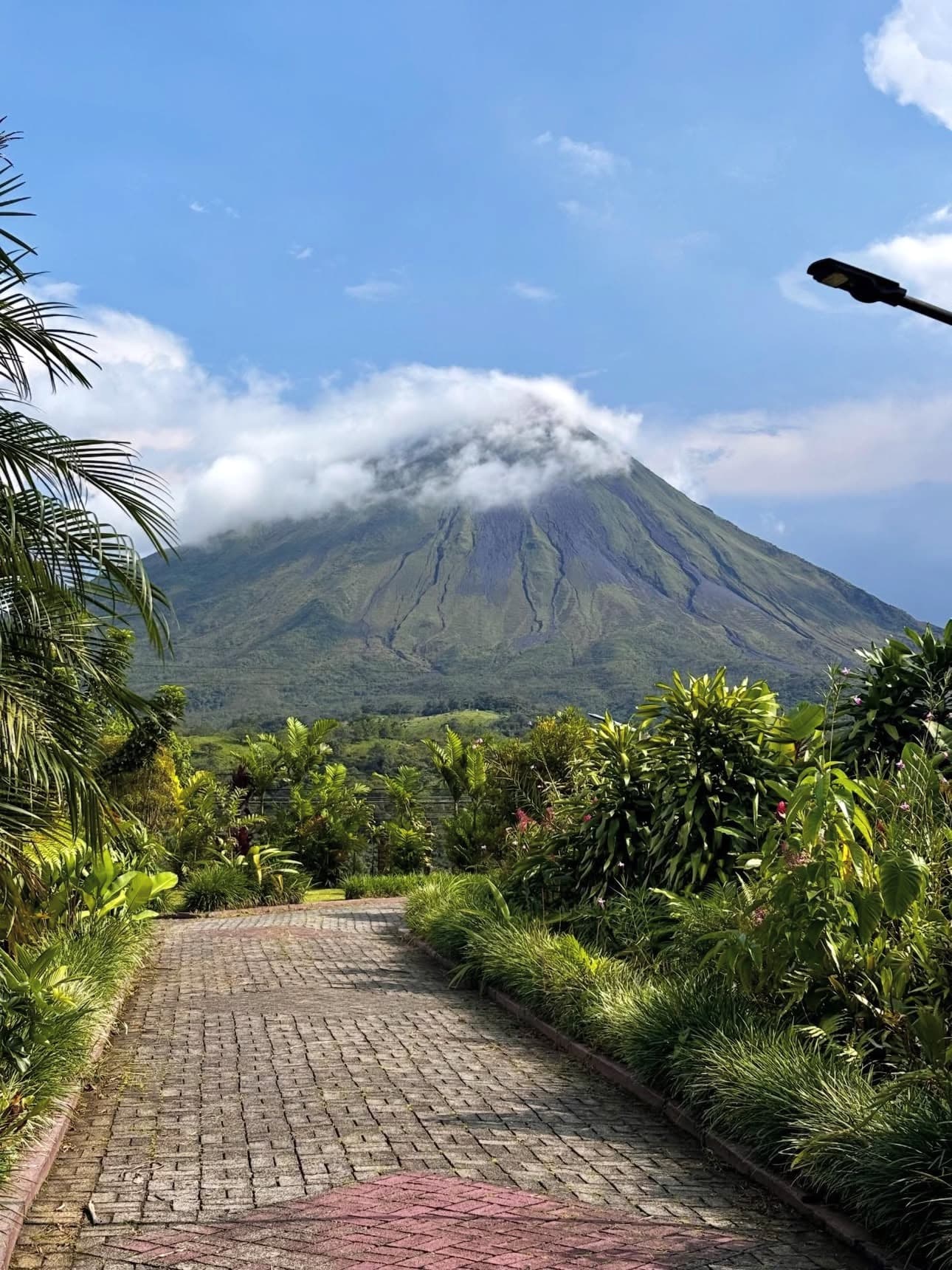 Misty rainforest near Arenal Volcano, Costa Rica — dramatic clouds and green canopy