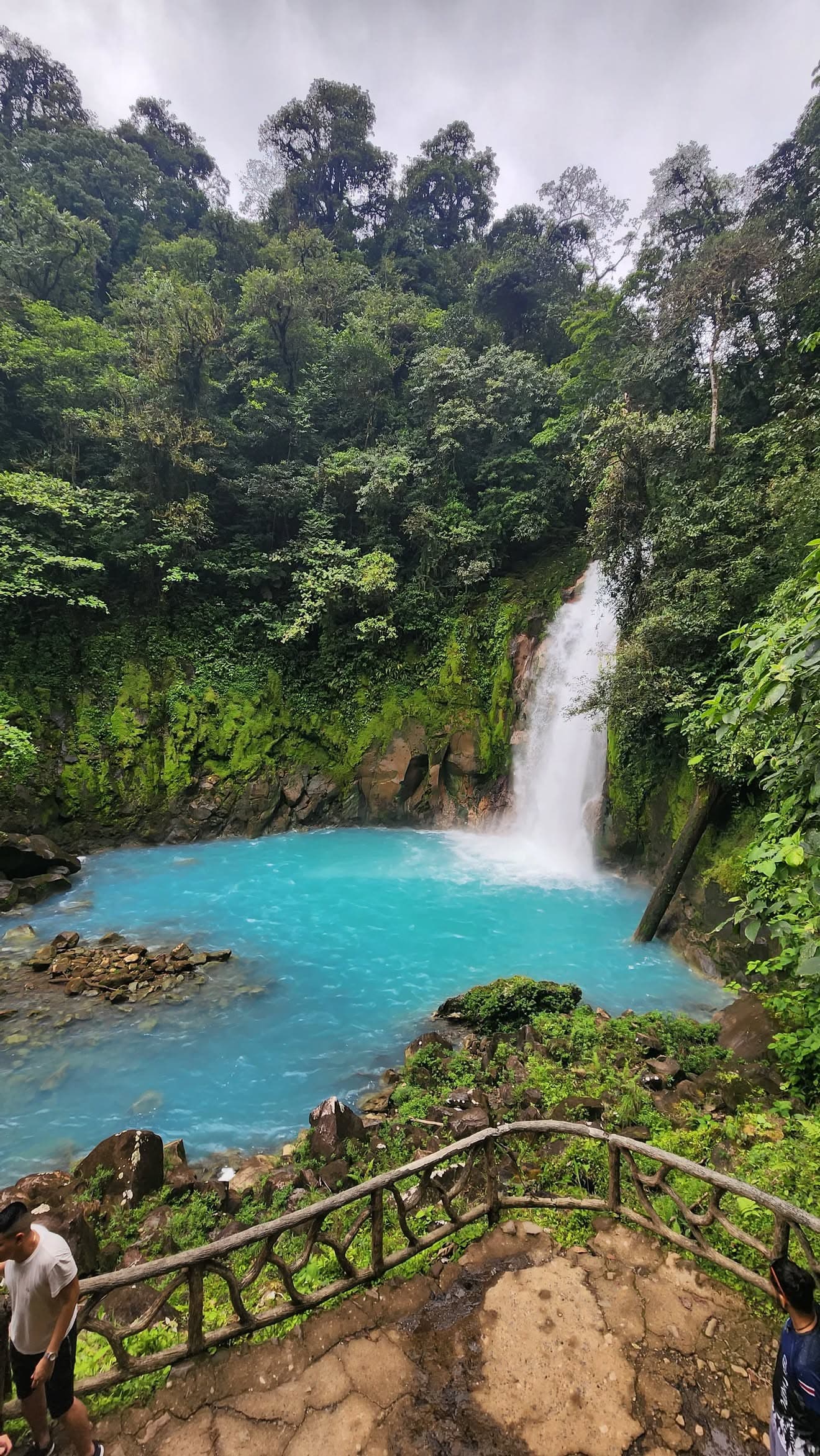 La Fortuna Waterfall surrounded by lush green rainforest in Costa Rica