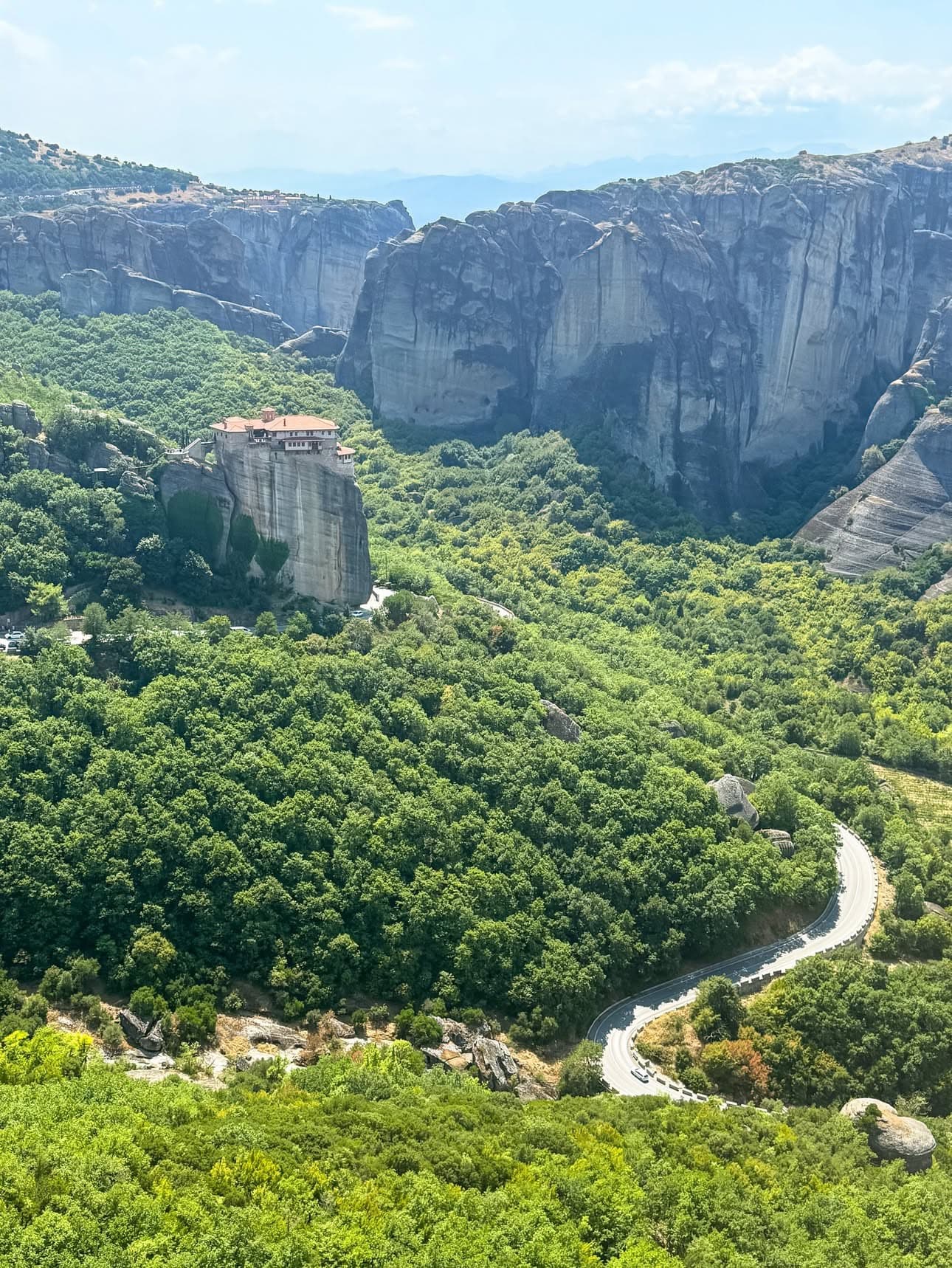 Meteora monastery at sunset with dramatic rock formations, Greece